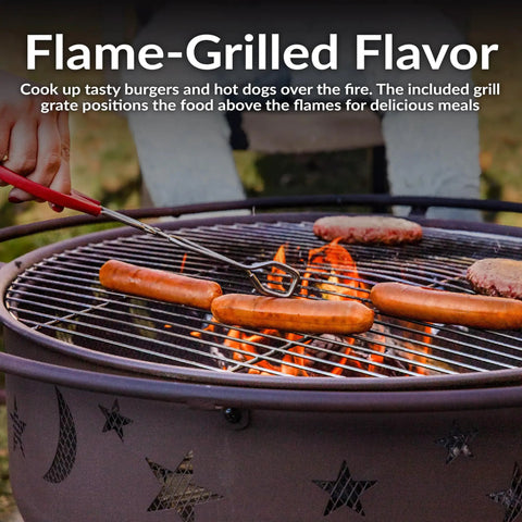 Close-up of sausages and burgers on the grill of a Bronze 30 Inch Outdoor Wood Burning Fire Pit With Grill Grate, Spark Screen, And Poker For Cozy Backyards And Campouts, Large Patio Fire Pit Perfect For Grilling Steaks And Burgers At Family Gatherings.