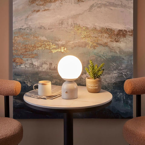 10 Inch Table Lamp With Marble Base And Frosted Glass Shade, Cozy Bedside Reading Light on a round table in a living room