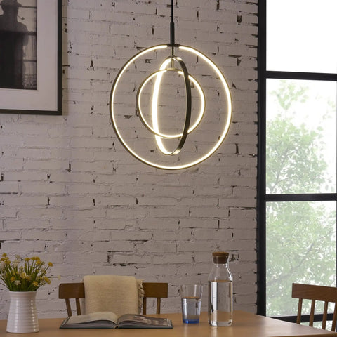 Black Modern 3 Ring Dimmable Pendant Chandelier for Dining Room, Kitchen Island, and Living Room, Adjustable Cord Farmhouse Industrial Lighting, Dope Hanging Lamp Fixture illuminating brick wall