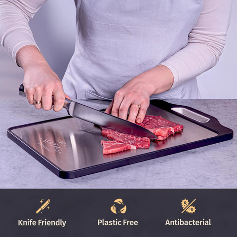 Front view of Matiks stainless steel cutting board, 16×11 inches, double-sided metal board with black border and built-in handle
