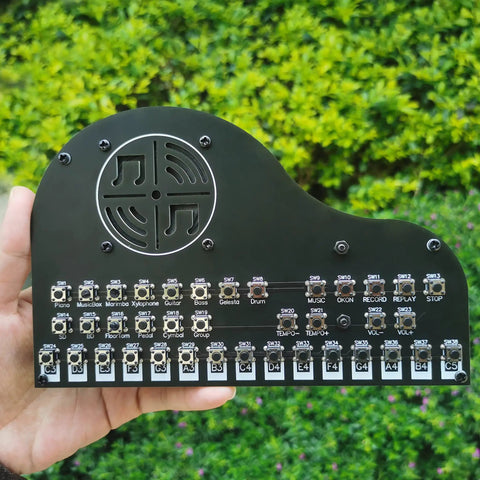 Hand holding a Hands On Soldering Practice Kit For Beginners And Hobbyists A DIY Electronics Project Learning Board outdoors