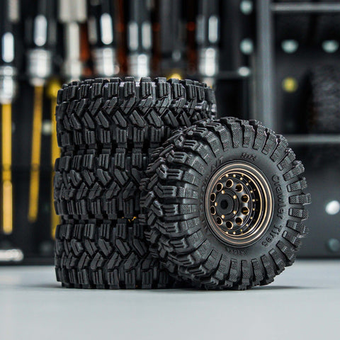 Brass Beadlock Wheel Set With Black Coating And S5 1.0 Crawler Tires For Axial SCX24 AX24 TRX4M FCX24 Upgrades shown stacked.