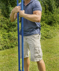 Man holding Heavy Duty Post Hole Digger With 48 Inch Steel Handle, 6.25 Inch Point Spread, Welded Tubular Steel Yokes For Digging In Hard Soil, Made In USA, Closeout Item, Limit 1 Per Order outdoors