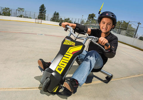 PowerRider 360 Drifting Trike Electric Ride On For Kids 9 MPH Top Speed With 40 Minute Run Time Dual Rear Caster Wheels For 360 Spins And Drifts Black Yellow, child riding outdoors
