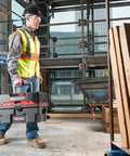 Worker carrying ProPack 4.5 Gallon Portable Wet Dry Shop Vacuum With Toolbox Design For Easy On The Go Cleanup at job site