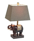 Festive Elephant Table Lamp In Brown With Gold Accent Resin Base And Brown Fabric Shade, Easy Reach Rotary Switch On Socket, 20 Inch Tall, 60W Equivalent Bulb Not Included, Cozy Yet Stylish Classic Home Decor displayed in side view.