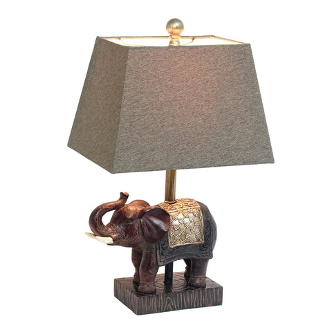Festive Elephant Table Lamp In Brown With Gold Accent Resin Base And Brown Fabric Shade, Easy Reach Rotary Switch On Socket, 20 Inch Tall, 60W Equivalent Bulb Not Included, Cozy Yet Stylish Classic Home Decor displayed in side view.