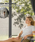 Woman relaxing by a 10X10 Outdoor Gazebo With Double Roof For Extra Shade And Ventilation Curtains And Mesh Netting For Bug Free Relaxation Heavy Duty Steel Frame With Ceiling Hook UPF 30 Plus Protection For Backyard Deck Or Lawn, with visible mesh netting