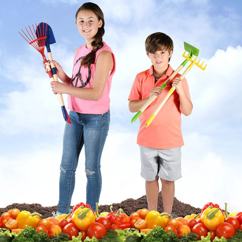 Kids holding Kids Garden Tool Set 4 Piece Shovel Rake Hoe Leaf Rake Wooden Gardening Tools For Kids in a garden setting.
