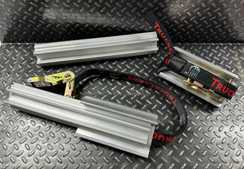 Emergency Tire Traction Aid With Extender Bars For Light Trucks To Medium Commercial Vehicles, aluminum bars and straps on textured surface