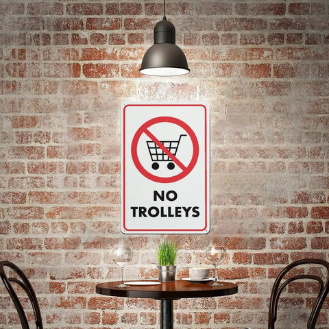 No Trolley Symbol 8 By 12 Warehouse Equipment Restriction Sign displayed on rustic brick wall setting.