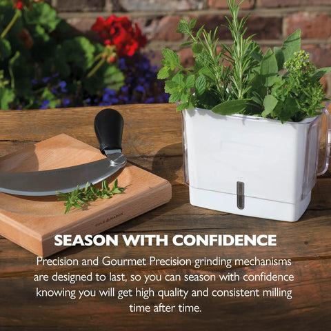 Fresh Herb Keeper For The Fridge With Flip And Slide Lid Acrylic Storage For Herbs And Veggies That Stay Crisp Up To 10 Days Easy Vented Herb Saver For Organizing Your Fridge on a wooden table with herbs