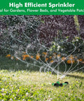 Three-Arm Metal Sprinkler With Wheel Base for 360 Degree Auto Rotary Lawn Watering in action on a green lawn.