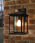 Hunnington One Outdoor Wall Lantern Light Fixture In Black, 1 Light, aluminum, mounted on brick wall, modern exterior design