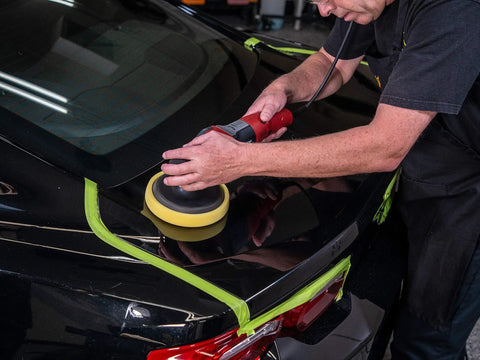 Person using Scratch And Swirl Remover 2.0 For Cars, Deep Gloss Shine That Pops, Remove Fine Scratches By Hand Or With A Machine on dark paint