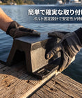 Gloved hands installing Arch Rubber Dock Shield for Dock Protection From Boat Impacts on a wooden dock.
