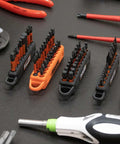 Screwdriver Bit Holder Storage Organizer 10 Hole Orange Bit Holder With Carabiner 2 Pack on workbench with assorted tools.