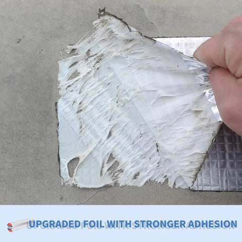 Close-up of Heavy Duty Butyl Waterproof Tape 20 Inch By 32.8 Feet Aluminum Foil Backed Seal Strip being applied on concrete surface.