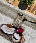 Electric Turkish Coffee Maker With Boil Dry Protection in Stainless Steel 600 Milliliter Capacity on a kitchen counter with accessories