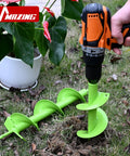 Upgrade Spiral Garden Auger Drill Bit 16 Inch By 4 Inch Heavy Duty Double Blade tool drilling soil in garden with cordless drill