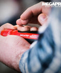 Person using 1 Inch 13 In 1 Ratcheting Automotive Driver Bit Set With Pullout Cartridge Red Handle.