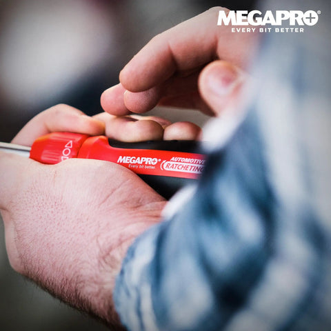 Person using 1 Inch 13 In 1 Ratcheting Automotive Driver Bit Set With Pullout Cartridge Red Handle.