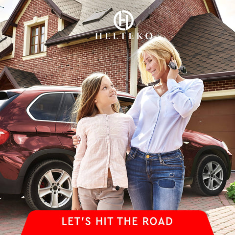 Mother and daughter smiling beside a red SUV parked in a residential driveway.