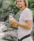 Person holding Multifunction Hiking Compass With Ruler And Mirror Luminous Navigation Tool in outdoor setting