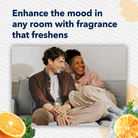 Couple relaxing on couch with Coastal Sunshine Citrus PlugIns Air Freshener Starter Kit, highlighting fresh oceanic citrus vibe.