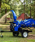 8 Inch Gas Powered Hydraulic Feeding Wood Chipper Shredder Towable With Tow Bar Electric Start in action on a sunny day