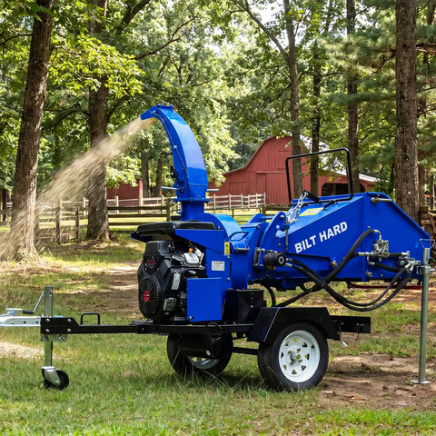8 Inch Gas Powered Hydraulic Feeding Wood Chipper Shredder Towable With Tow Bar Electric Start in action on a sunny day