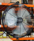 WindPro18W Wall Mount Fan High Velocity Industrial Shop Garage Fan With 3 Speed Settings And 3000 CFM Black. Mounted on wall in workshop.