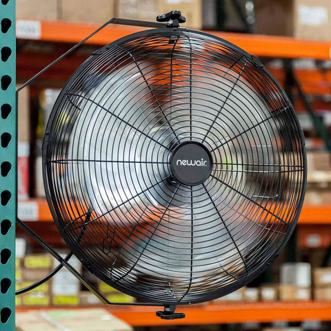 WindPro18W Wall Mount Fan High Velocity Industrial Shop Garage Fan With 3 Speed Settings And 3000 CFM Black. Mounted on wall in workshop.