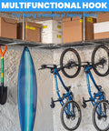 Bikes and equipment hung on 6 Pack Heavy Duty Bike Hooks For Garage Ceiling With Screws Included, 70 Lbs Capacity Per Hook, Sturdy Iron Construction For Overhead Storage, Easy Access Bike Parking And Clutter Free Garages.