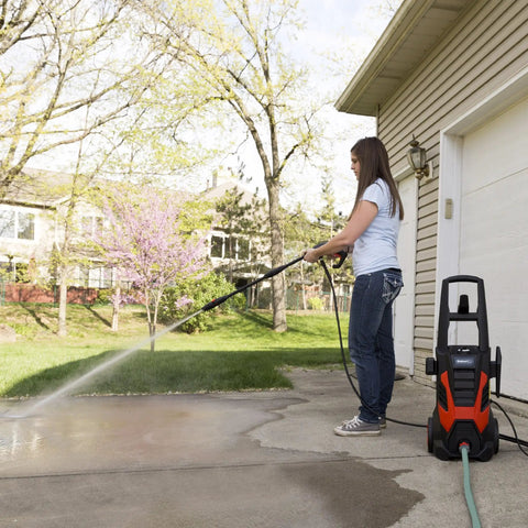 Person using Beastly 2000 Max PSI Electric Powered Pressure Washer With 14.5 Amp Motor, 1.5 GPM to clean driveway.