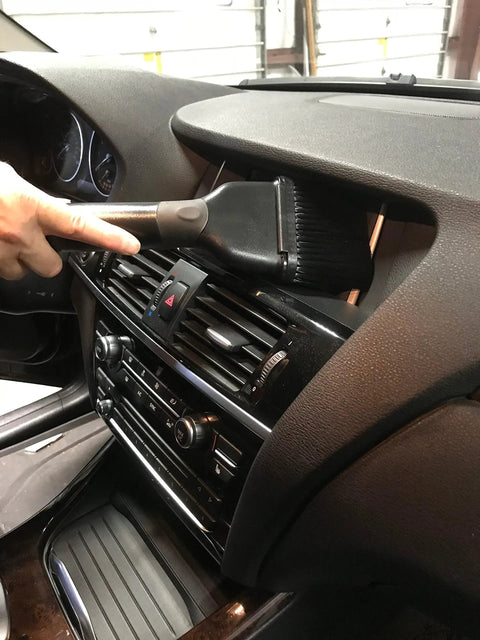 Using a Shop Vacuum Garage Kit With 30 Foot Commercial Grade Hose in car air vent for non clog airflow and high flexibility