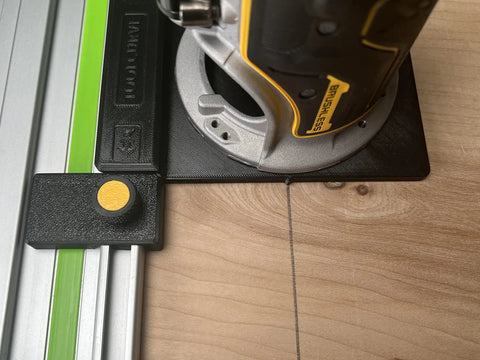 Slick Guide Rail Adapter For Trim Routers with steel connector showing precise cut on wood surface.
