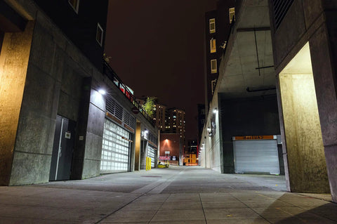 Urban alleyway at night, lit by Hardy Emergency Lighting Fixture With 90-Minute Battery Backup, 3000K Soft White Or 5000K Daylight.