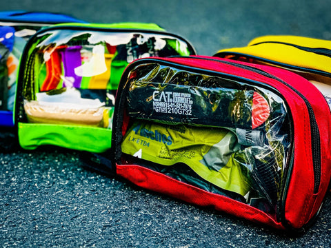 Lightning X color-coded first aid kit pouches with transparent windows, set of 4, front view.