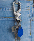 Heavy Duty Metal Keychain Set With Carabiner Clip, Bottle Opener And Three Key Rings attached to a jeans pocket