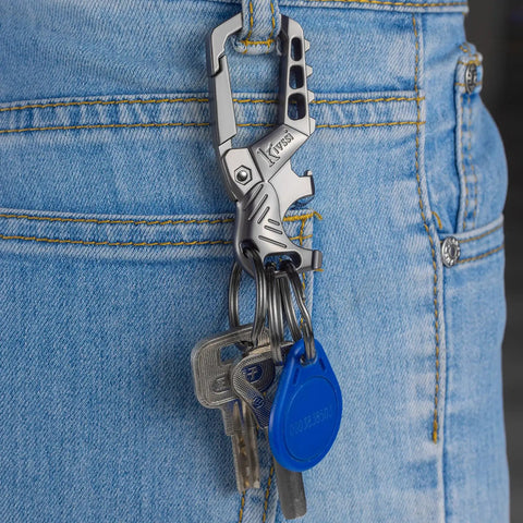 Heavy Duty Metal Keychain Set With Carabiner Clip, Bottle Opener And Three Key Rings attached to a jeans pocket