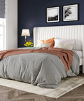 White Queen Velvet Bed Frame With Upholstered Wingback Headboard And Vertical Tufted Design Built On Heavy Duty Metal Base With Wooden Slats For Quick No Box Spring Bedroom Setup That Brings Major Style And Hits Different in a stylish bedroom setting.