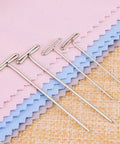 Heavy Duty Stainless Steel T Pins For Blocking And Knitting on pink and blue fabric, showing 38mm and 51mm sizes.