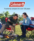 Couple sitting outdoors on Broadband Mesh Quad Camping Chairs with Carry Bag and Cup Holder, enjoying a campfire.