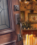Hawthorne Front Door Lock Set With Deadbolt And Exterior Handleset, interior view on wooden door, Venetian Bronze Finish