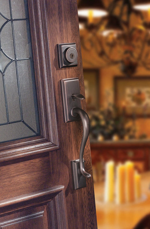 Hawthorne Front Door Lock Set With Deadbolt And Exterior Handleset, interior view on wooden door, Venetian Bronze Finish