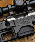 Close-up of Modular Rifle Chassis for Remington 700 Short Action 3.0 Inch AICS with rail system and scope, USA-made
