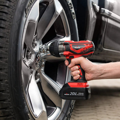 Person using Beefy 20V Cordless Impact Wrench Kit With 300 Ft Lb Torque on car tire lug nuts
