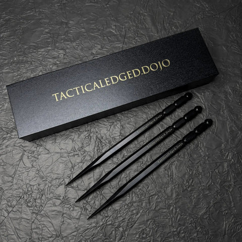 Set Of 3 Bo Shurikens With Precision Balanced Throwing Spikes Hexagonal Body For Stable Grip next to box on textured surface.