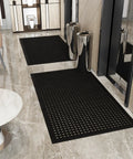 Heavy Duty Rubber Floor Mat With Grippy Non Slip Surface For Commercial Kitchens And Workshops, Waterproof And Hose Washable, Anti Fatigue Comfort, Oil Resistant, Perforated Drainage Design For Indoor Or Outdoor Use, 36 By 60 Inches, Black placed in an indoor entryway